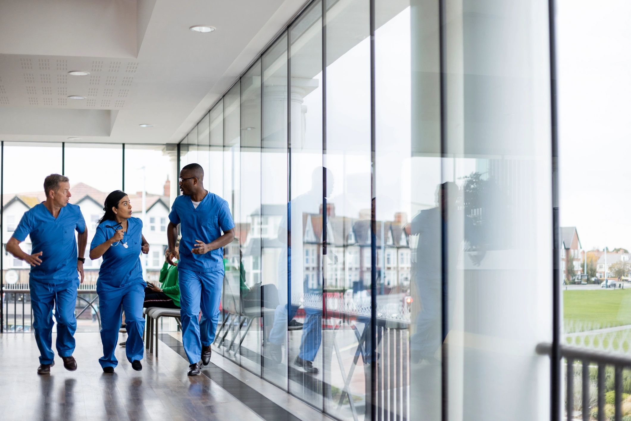 Healthcare team responding quickly in a hospital corridor