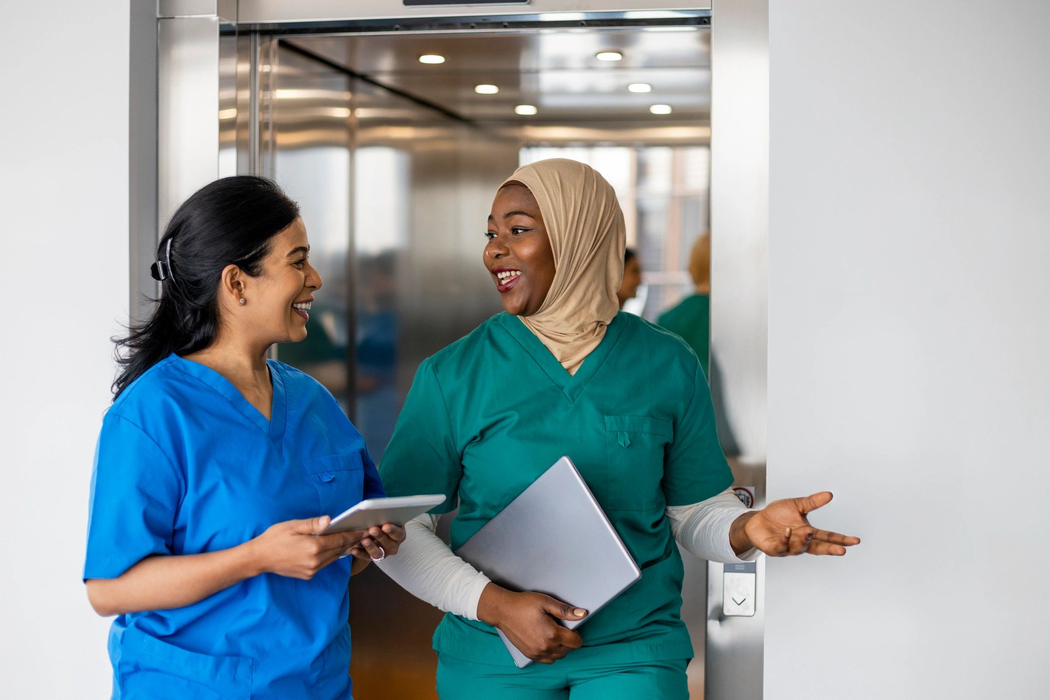 Medical professionals walking together in hospital corridor