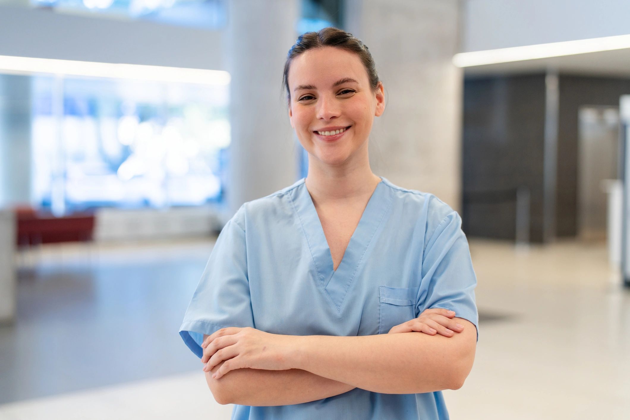 Confident nurse standing in a hospital hallway